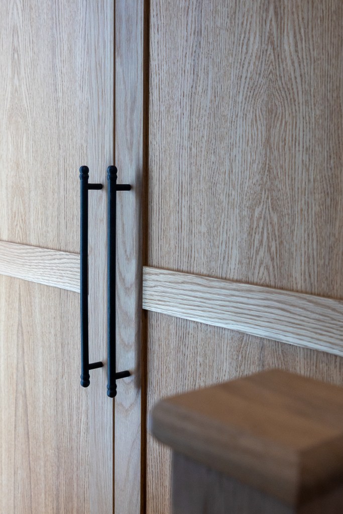 Bespoke Oak fitted Cabinet in an awkward space above some stairs