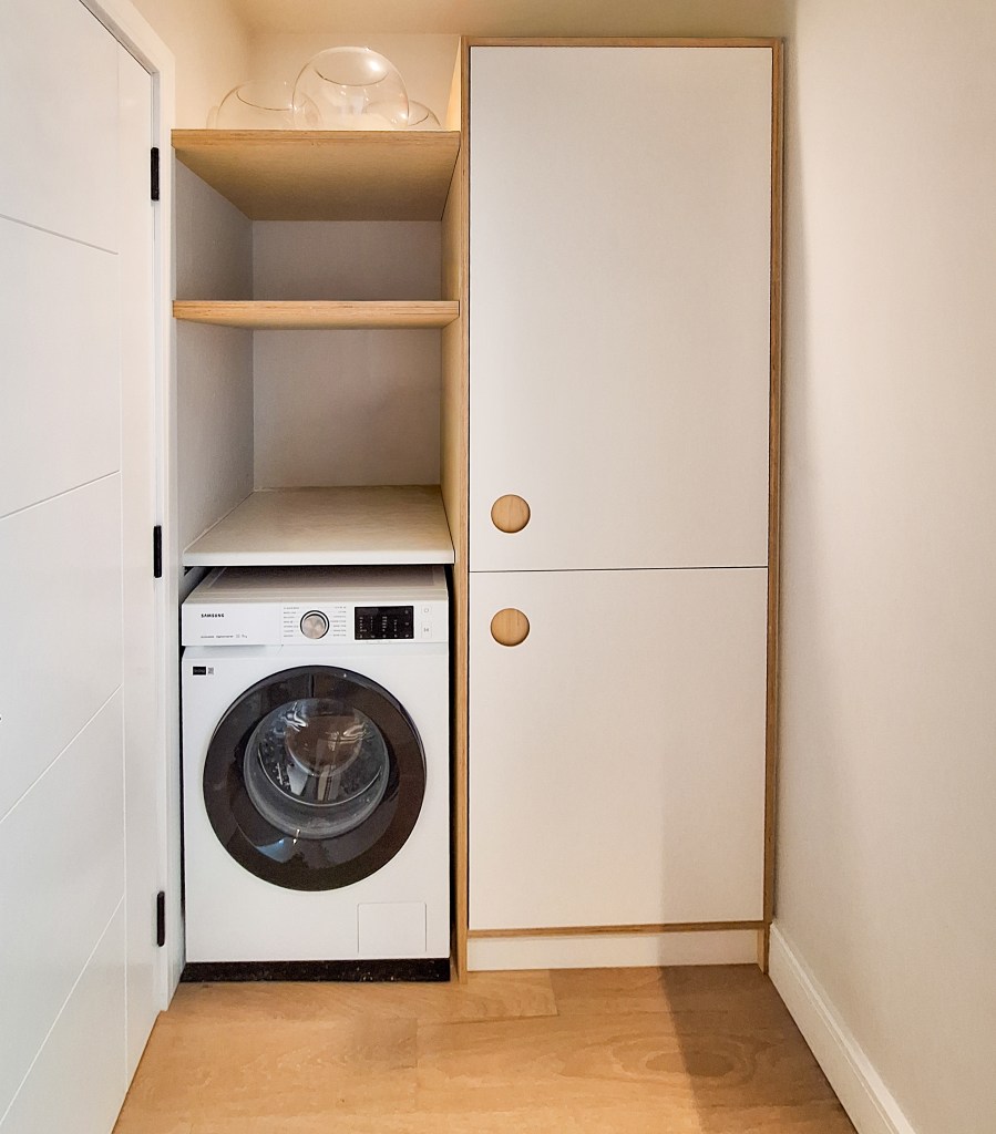 Bespoke birch plywood laundry cabinet with white melamine faces