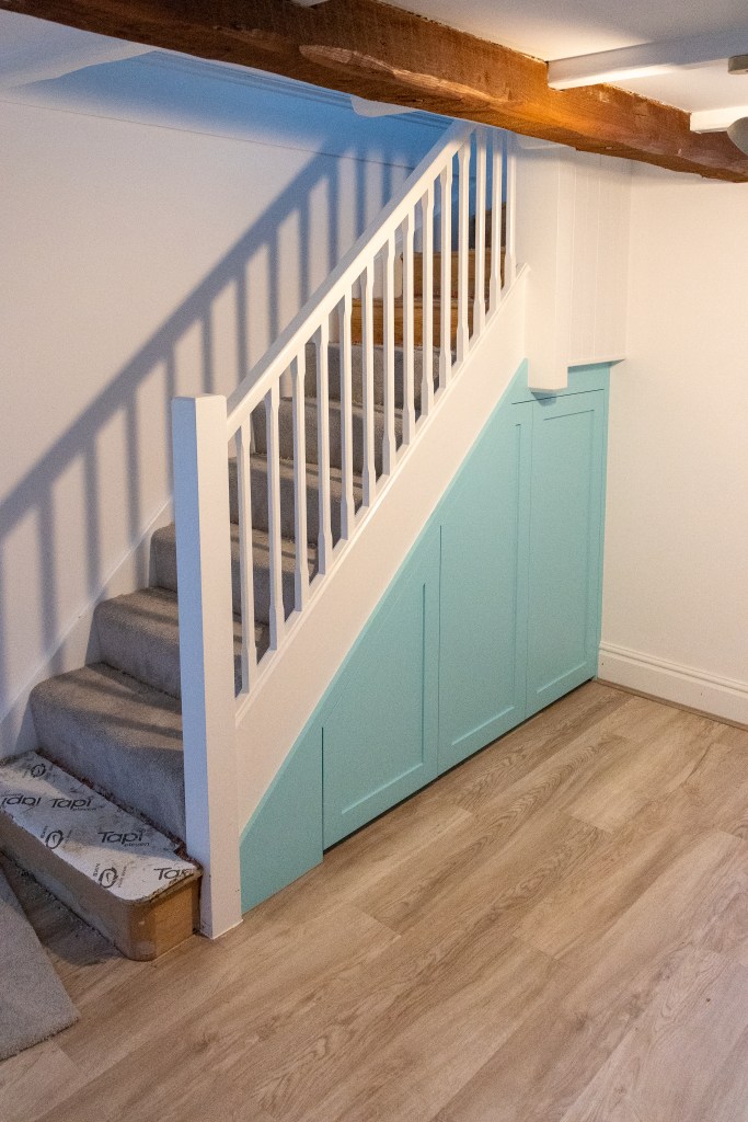 Understair storage under stair pull out drawer shaker door