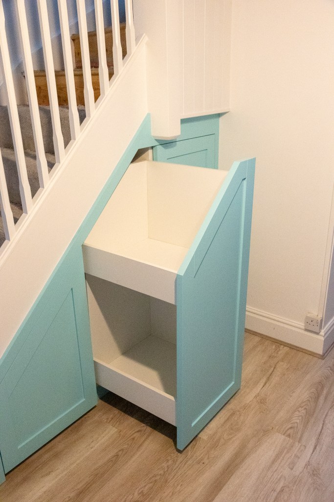 Understair storage under stair pull out drawer shaker door