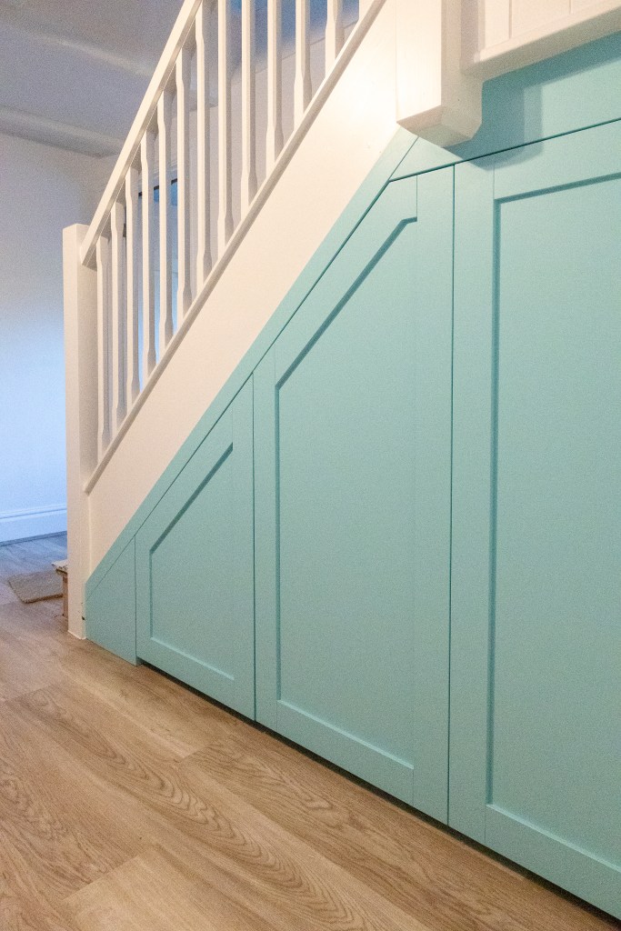 Understair storage under stair pull out drawer shaker door